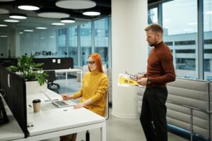 HR manager looking into assessment data on her computer